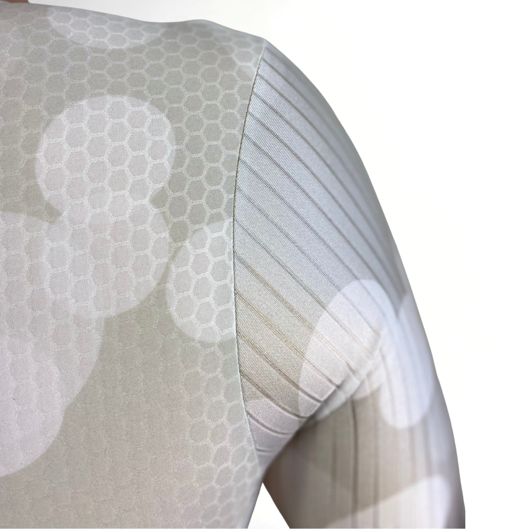 Close-up of a Tri Suit material with a subtle pattern on a white background