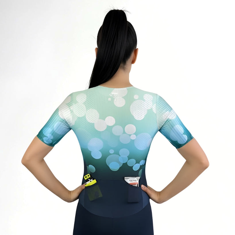 Person wearing a Tri Suit with a blue and green gradient design on a white background