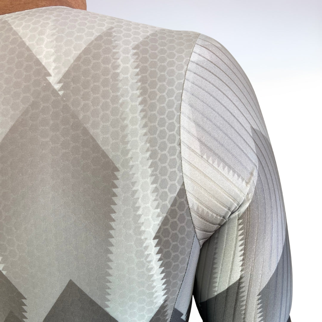 Close-up of a textured fabric with geometric pattern on a white background