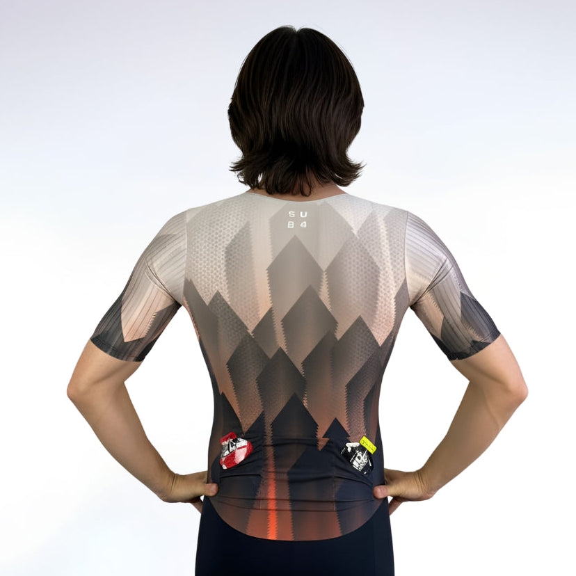 Person wearing a geometric patterned Tri Suit on a white background
