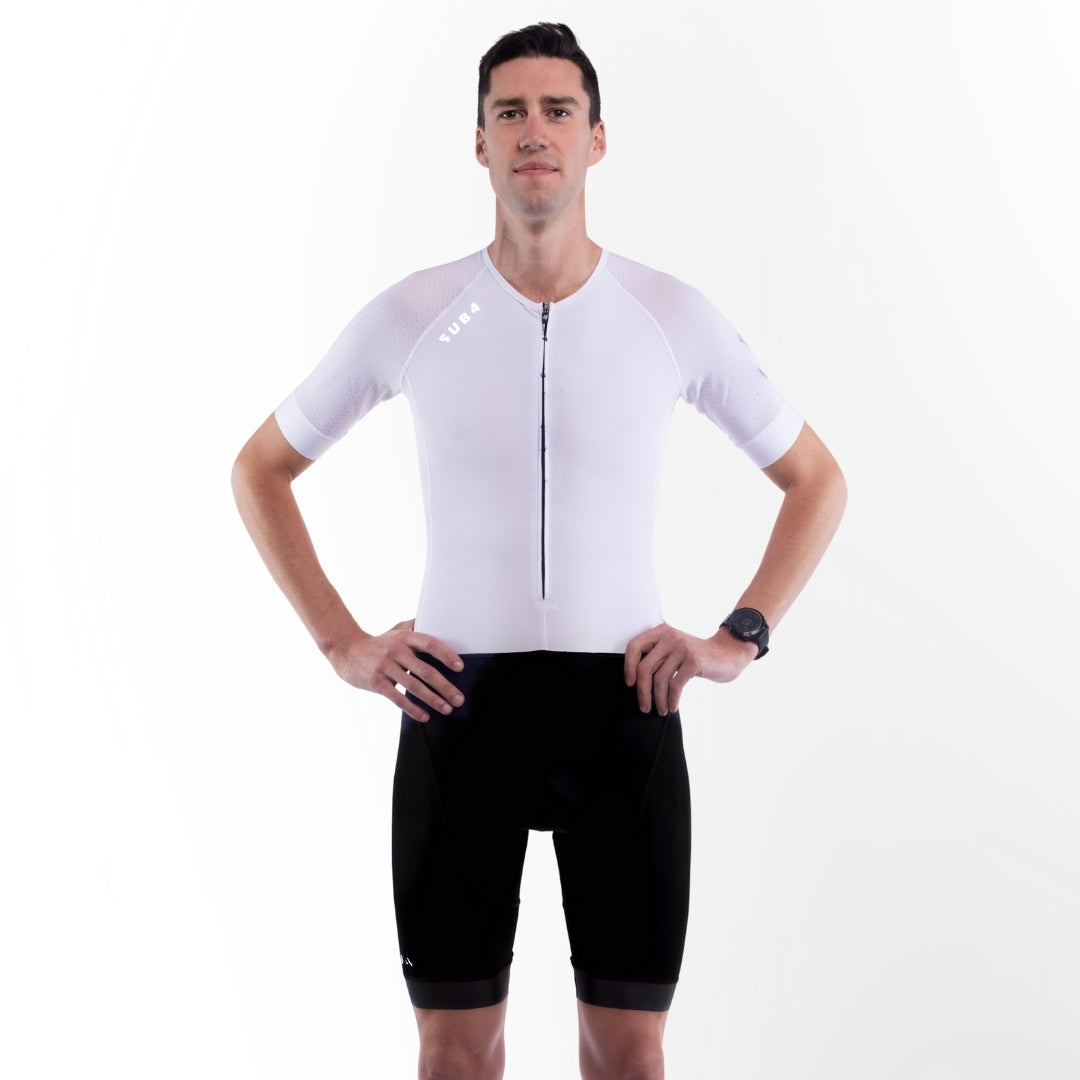 Person wearing a white Triathlon suit on a white background