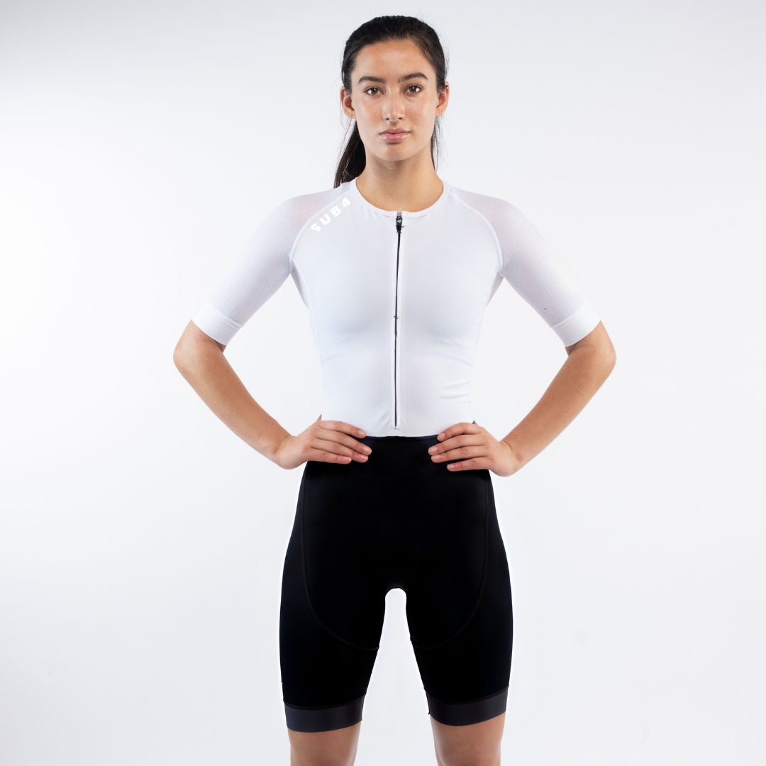 Person wearing a white Triathlon suit on a white background