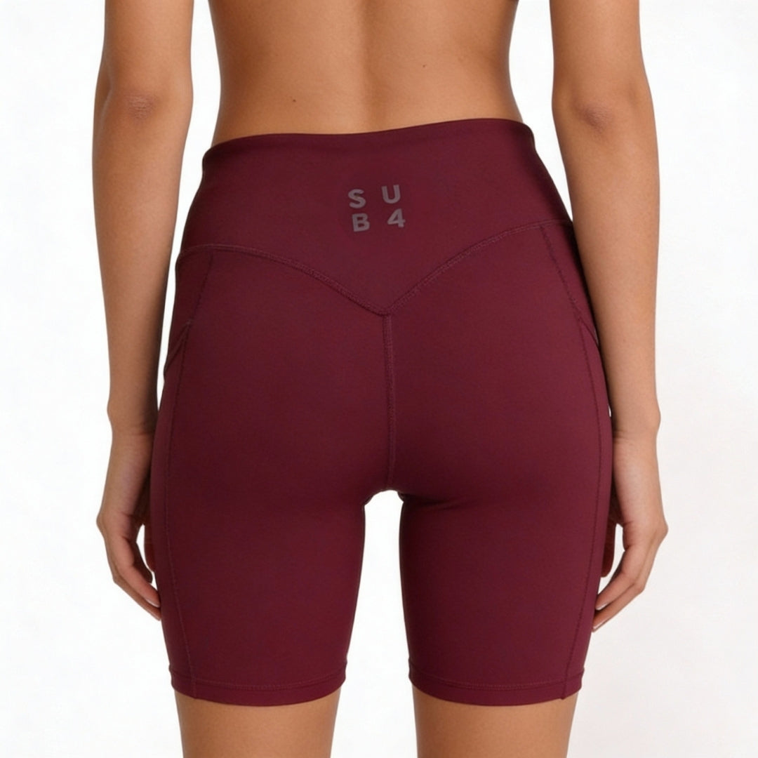 Maroon athletic shorts with 'SUB4' branding on a white background