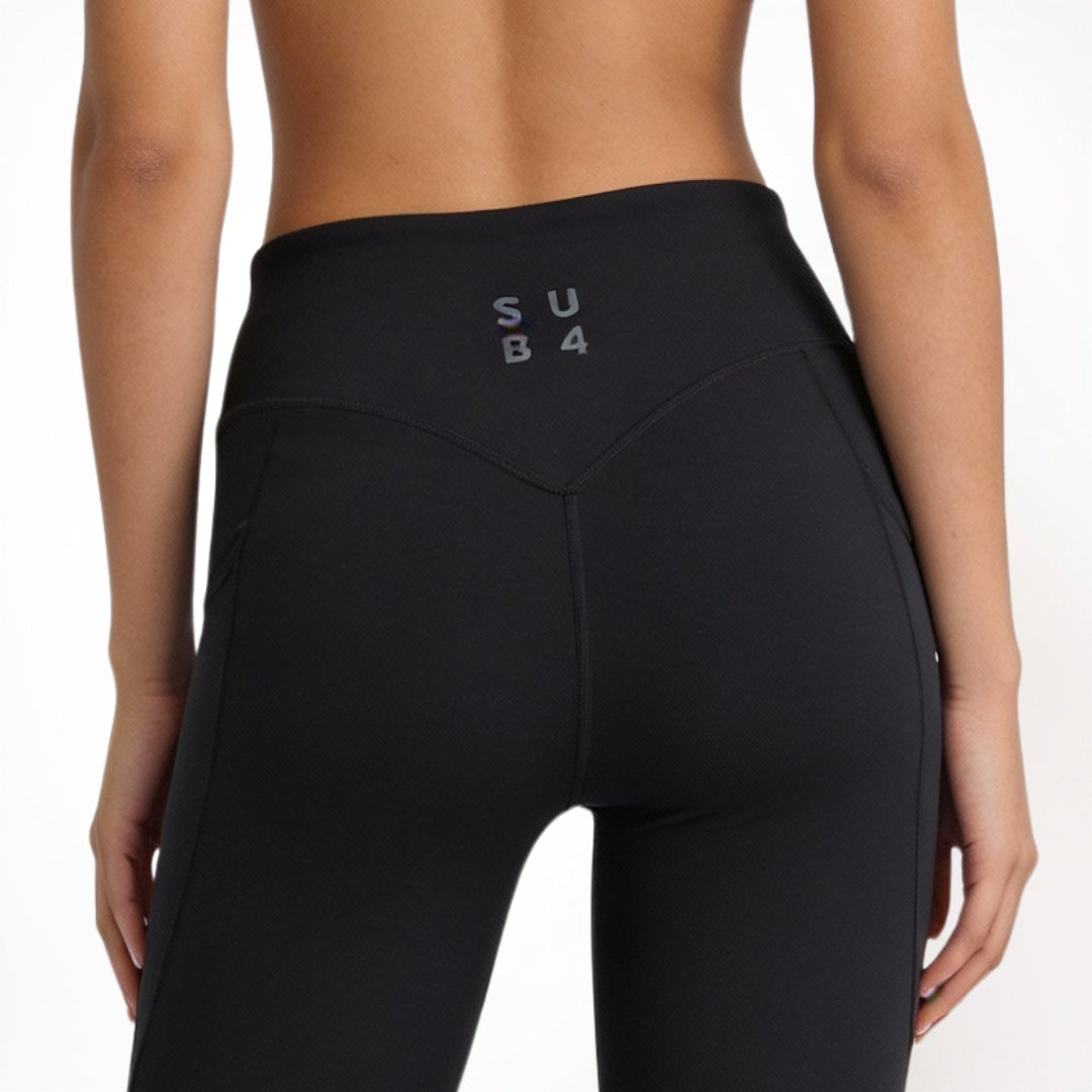 Black athletic yoga leggings with 'SUB4' logo on a white background