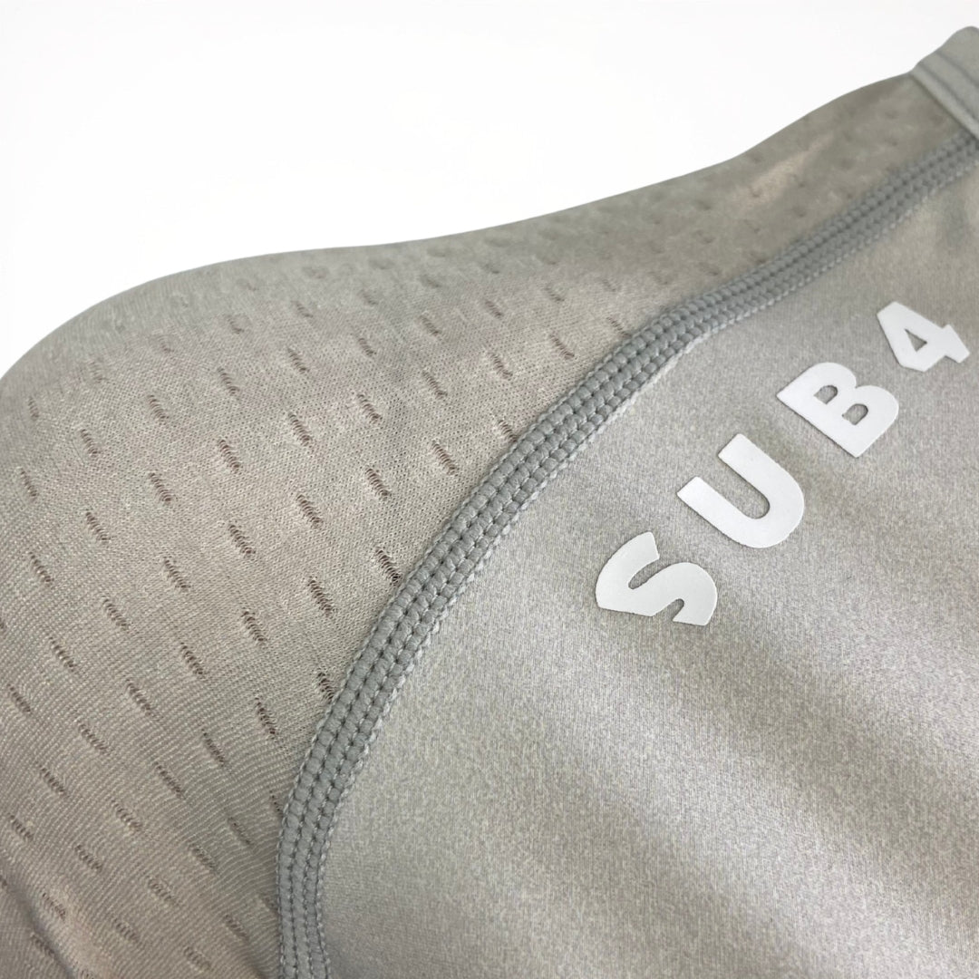 Graphite athletic shirt with 'SUB4' branding on a white background