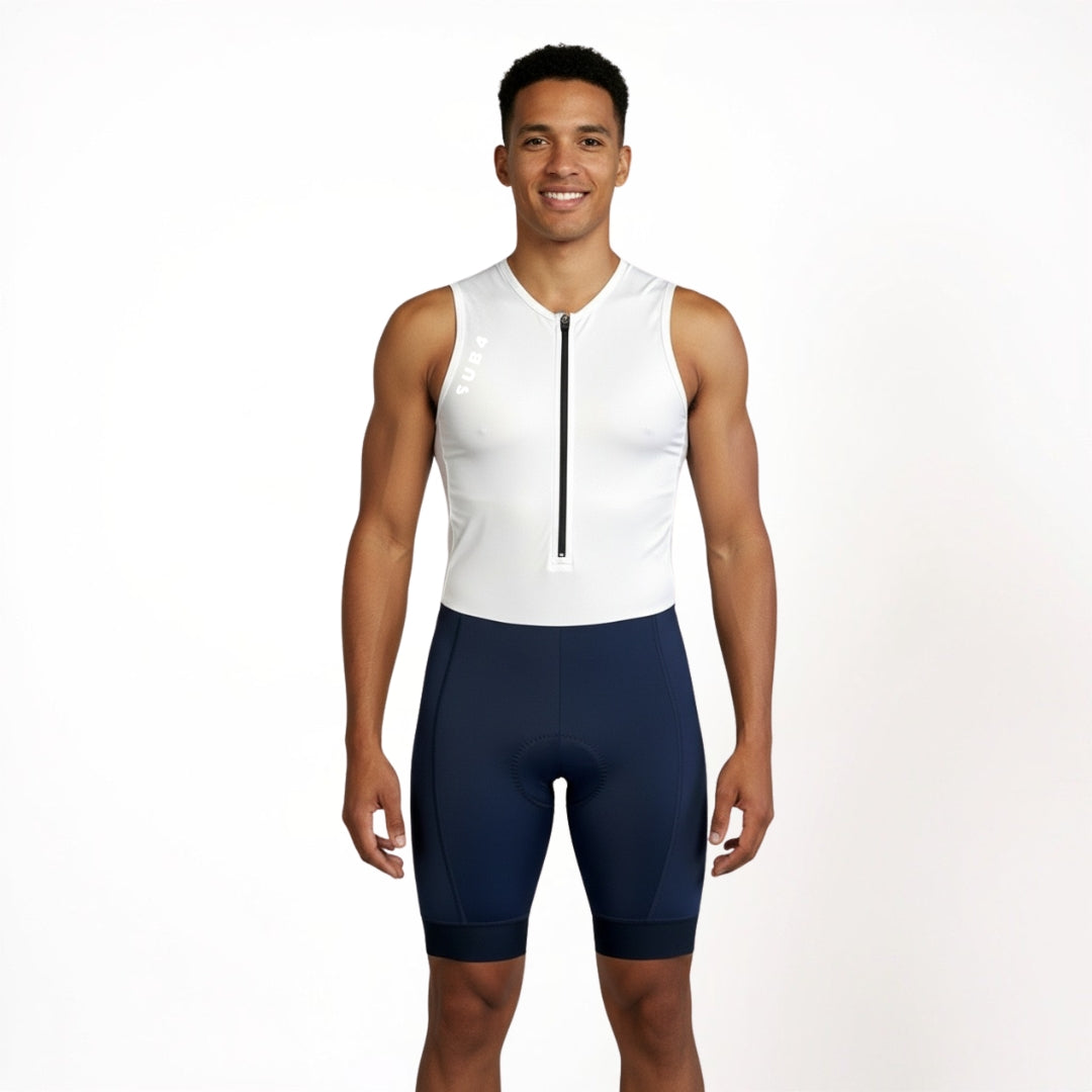 Man wearing a white sleeveless Triathlon suit with navy shorts on a white background