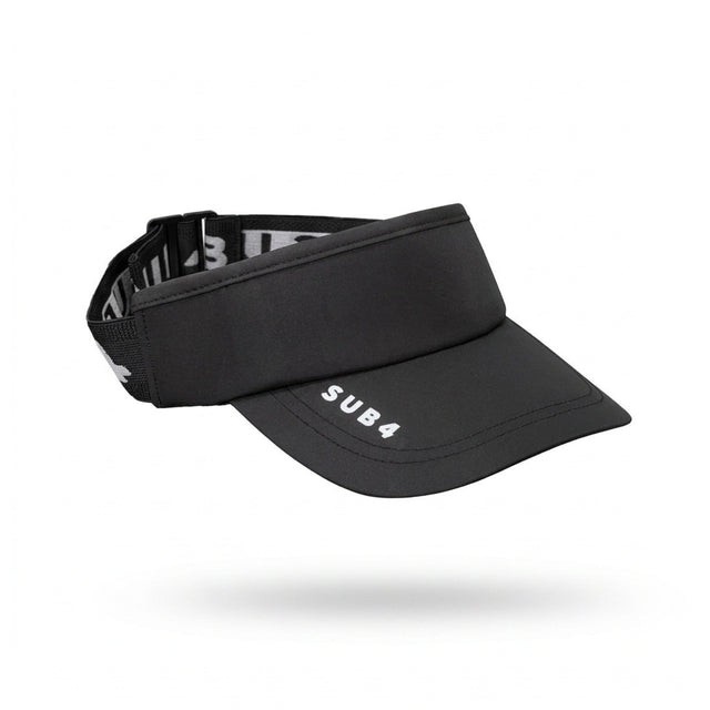 A black athletic visor with a curved brim and an adjustable black elastic back strap, featuring the white text 'SUB4' on the brim and 'SUB4' branding printed on the side of the strap, shown against a plain white background.