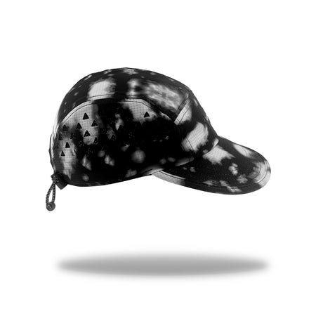 A black and grey running cap with a small hanging drawstring, shown floating against a white background with a soft shadow underneath.