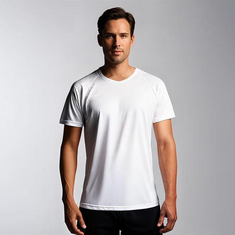 Man wearing a plain white t-shirt against a gray background