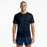 Person wearing a black running t-shirt with navy patterns and navy running shorts on a white background