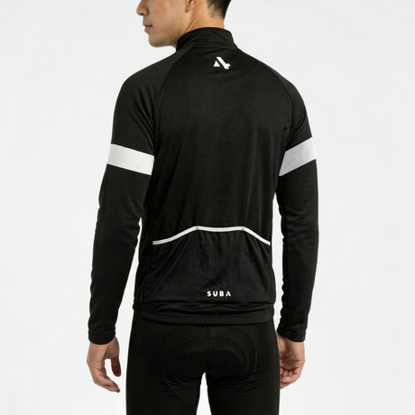 Person wearing black cycling jersey and shorts with white reflective accents on a light gray background