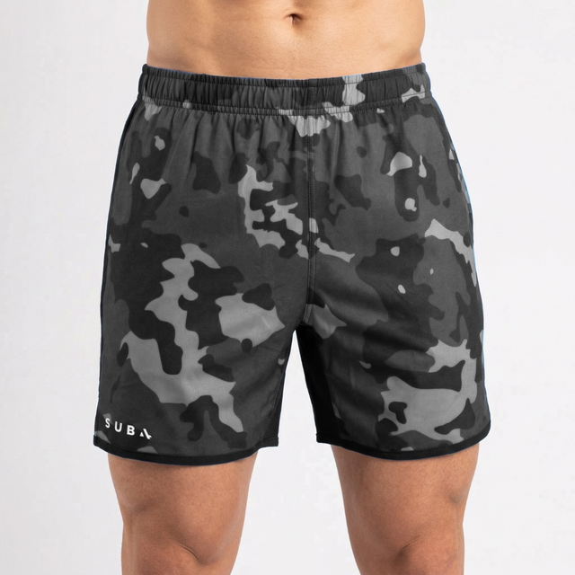 Camouflage shorts worn by a person on a white background