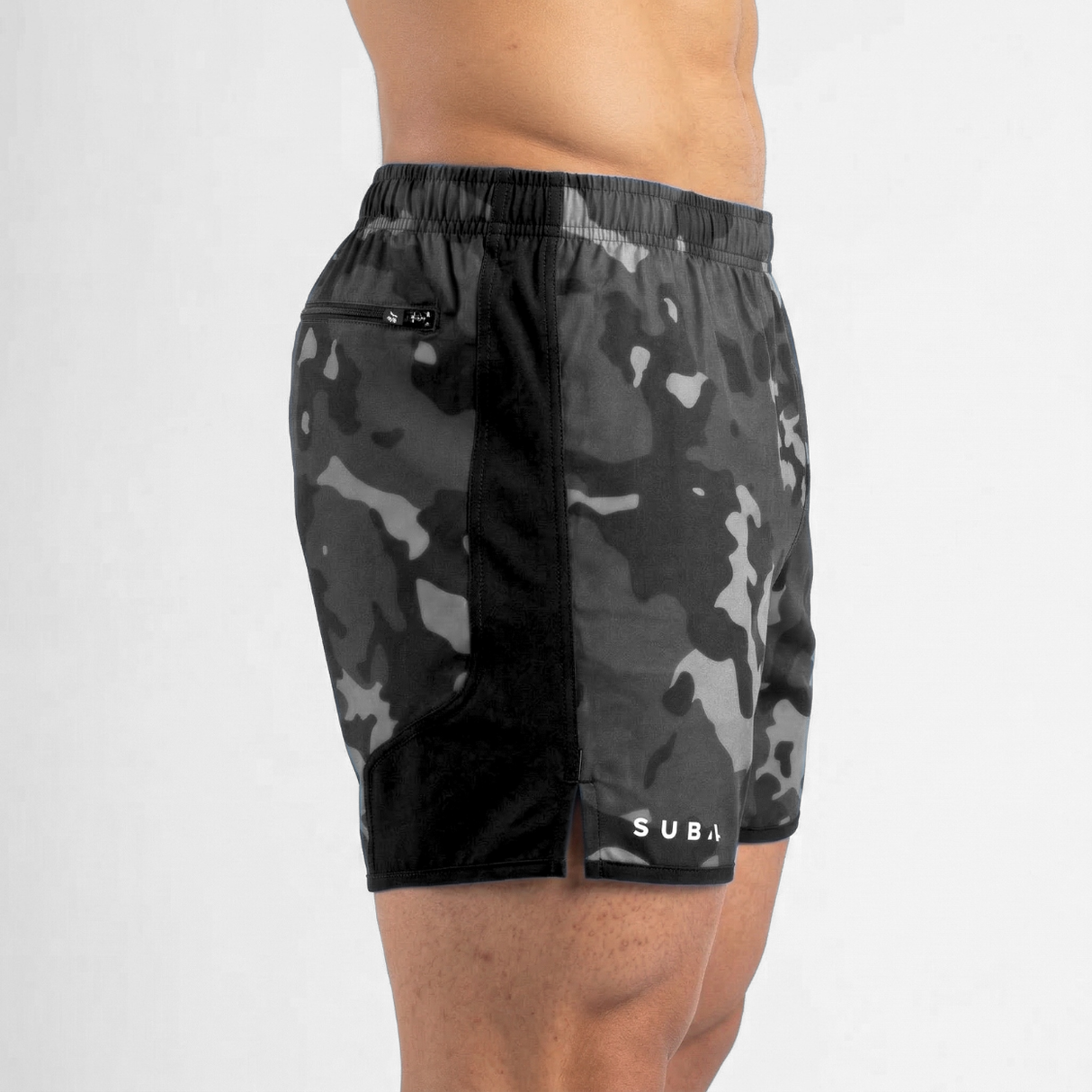 Camouflage shorts worn by a person on a white background