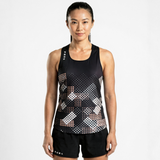 Woman wearing a black athletic tank top with geometric pattern on a white background