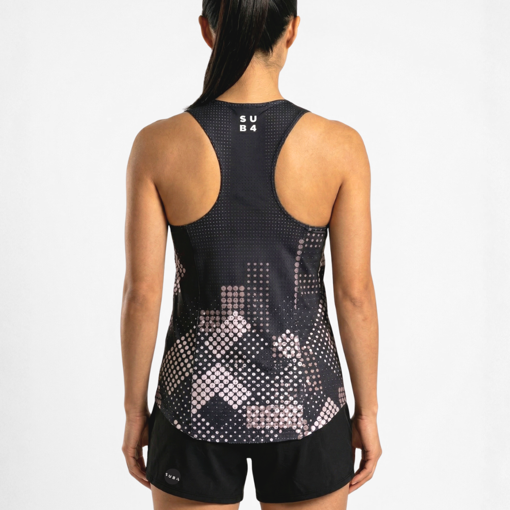 Person wearing a black athletic tank top with geometric pattern on a white background