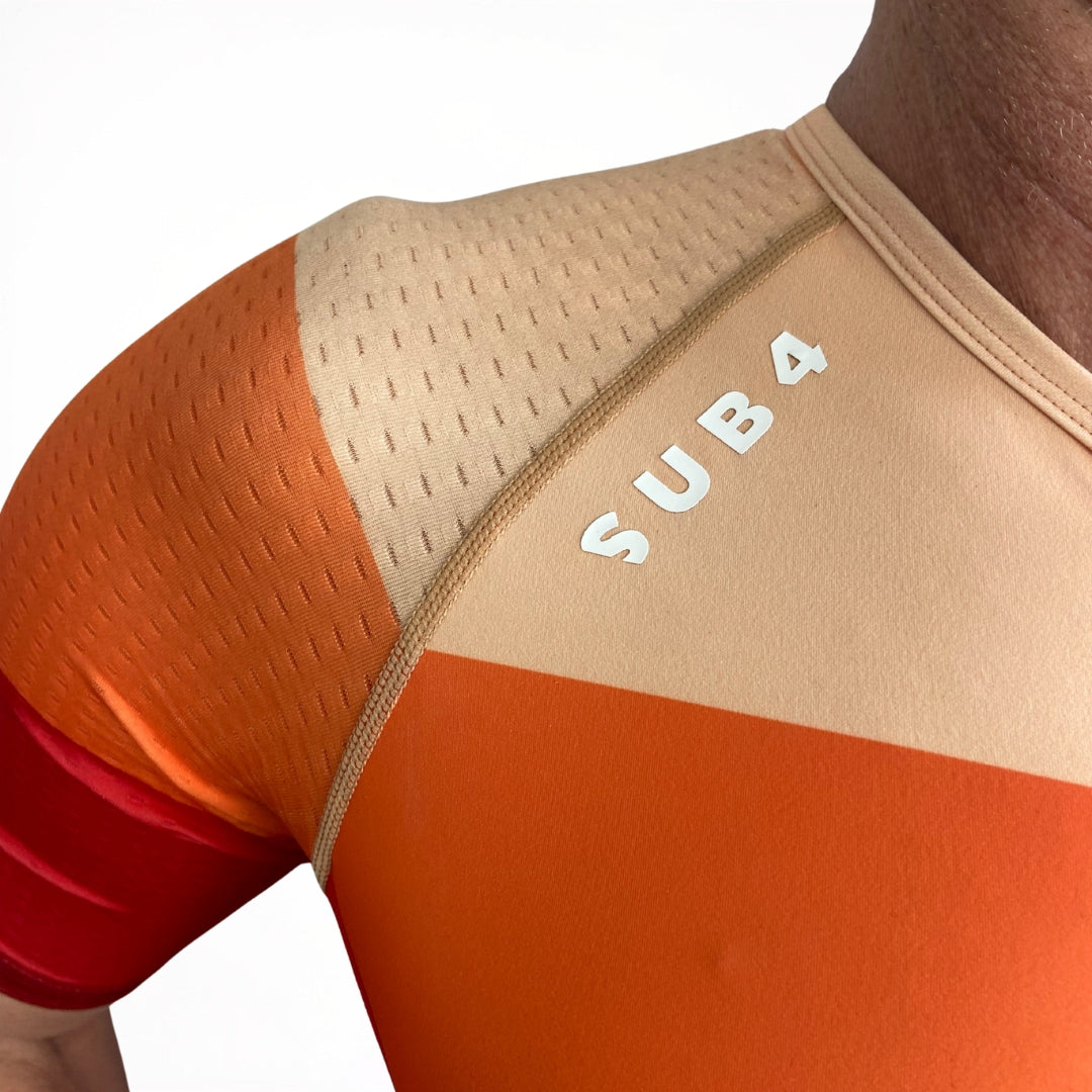 Tri suit close up with 'SUB4' branding on a white background