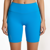 SUB4 blue athletic shorts worn by a person on a white background