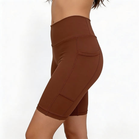 Brown athletic shorts on a white background