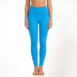 Blue athletic yoga leggings worn by a person on a white background
