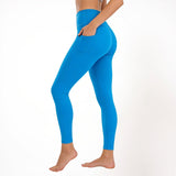 Blue athletic gym yoga leggings worn by a person on a white background