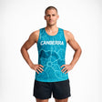 Man wearing a blue tank top with 'Canberra' printed on it against a white background