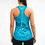 Person wearing a blue tank top racerback singlet with a Canberra map design on a plain background