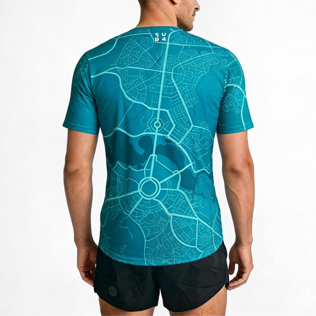 Person wearing a blue t-shirt with Canberra map design on a white background