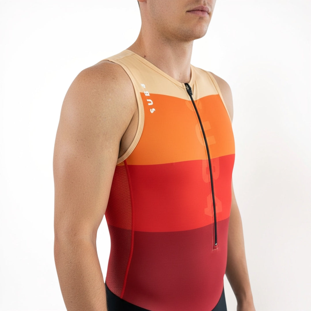 Person wearing a sleeveless triathlon top with orange and red gradient on a white background