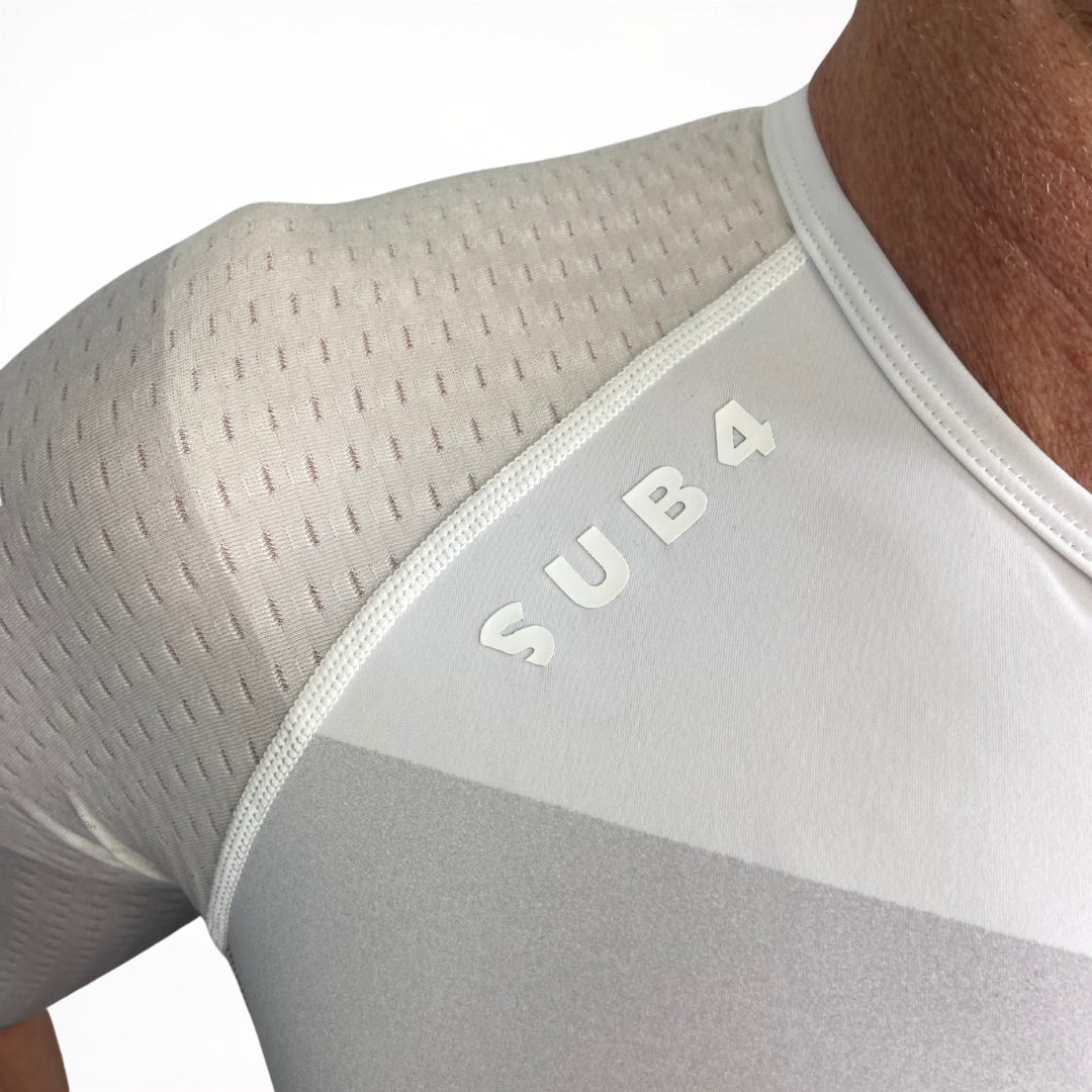 Grey Tri Suit with 'SUB4' branding on a person wearing it.