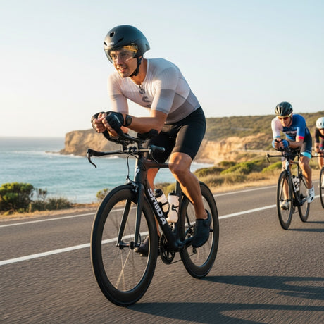 Cyclists riding on a road with ocean views